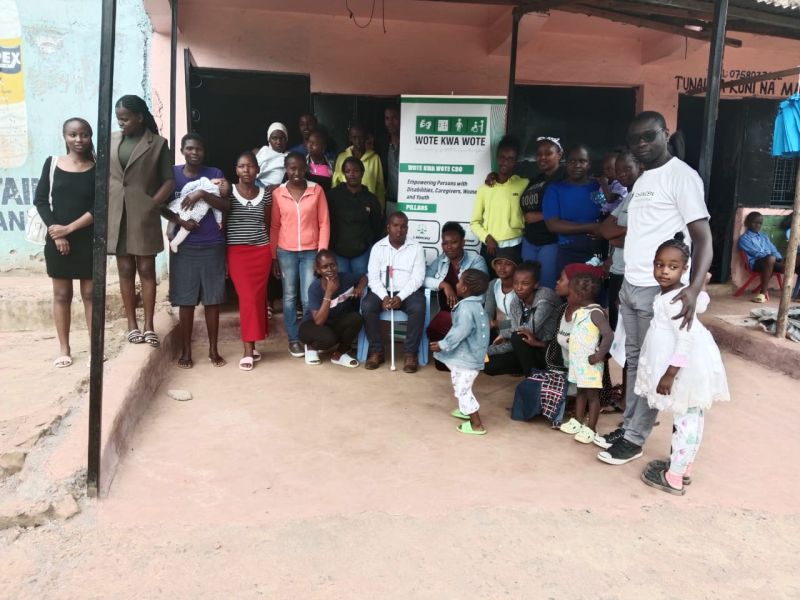 Youth Voice Project participants with Wote Kwa Wote banner