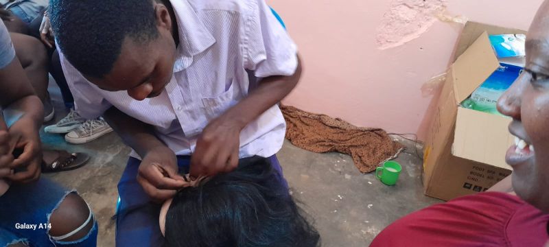 Youth learning hairdressing skills